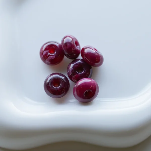 Perles rondelles 12x7 mm en résine opaque - Grenat marbré x6