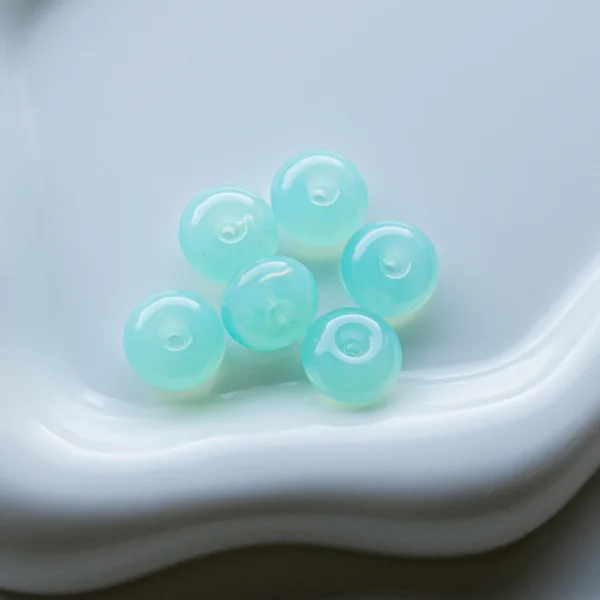 Perles rondelles 12x7 mm en résine translucide - Vert d'eau x6